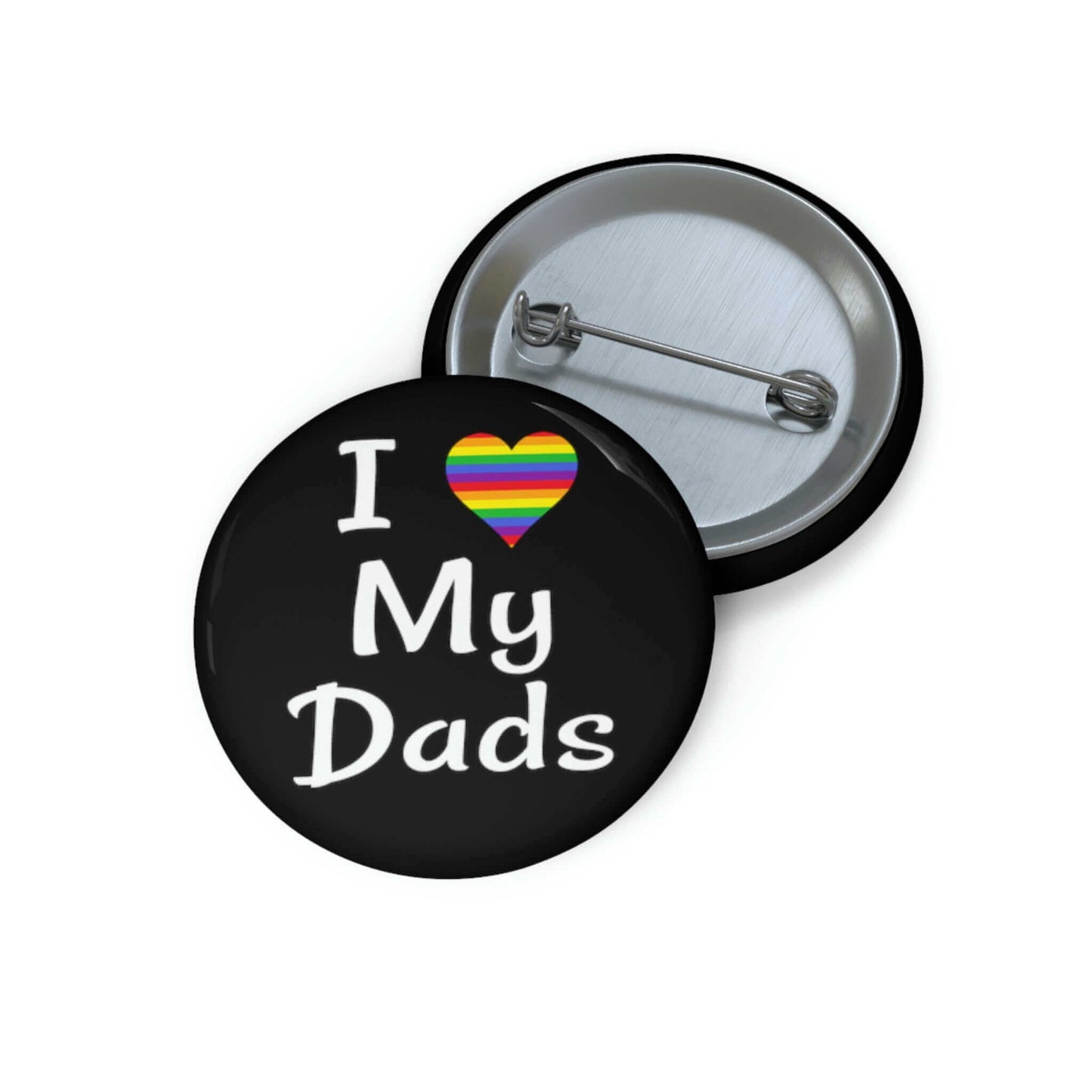 Black pin-back button that says I heart my dads. The heart is rainbow.