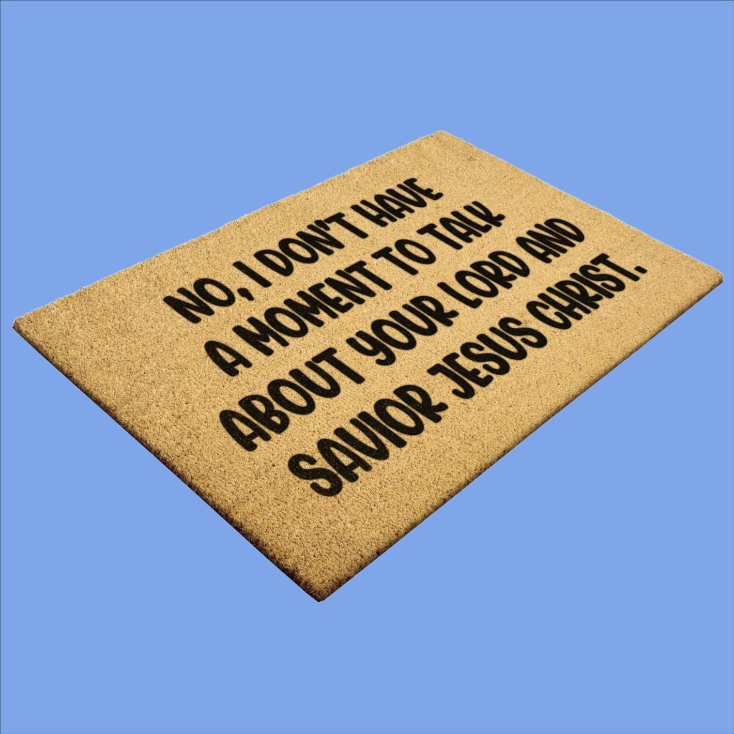 Tan color coconut coir fiber doormat with the phrase No, I don't have a moment to talk about your lord and savior Jesus Christ printed in black.