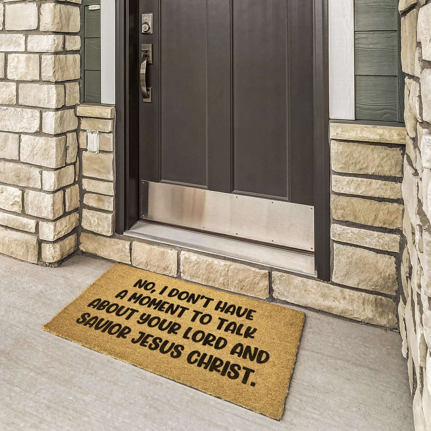 Tan color coconut coir fiber doormat with the phrase No, I don't have a moment to talk about your lord and savior Jesus Christ printed in black.