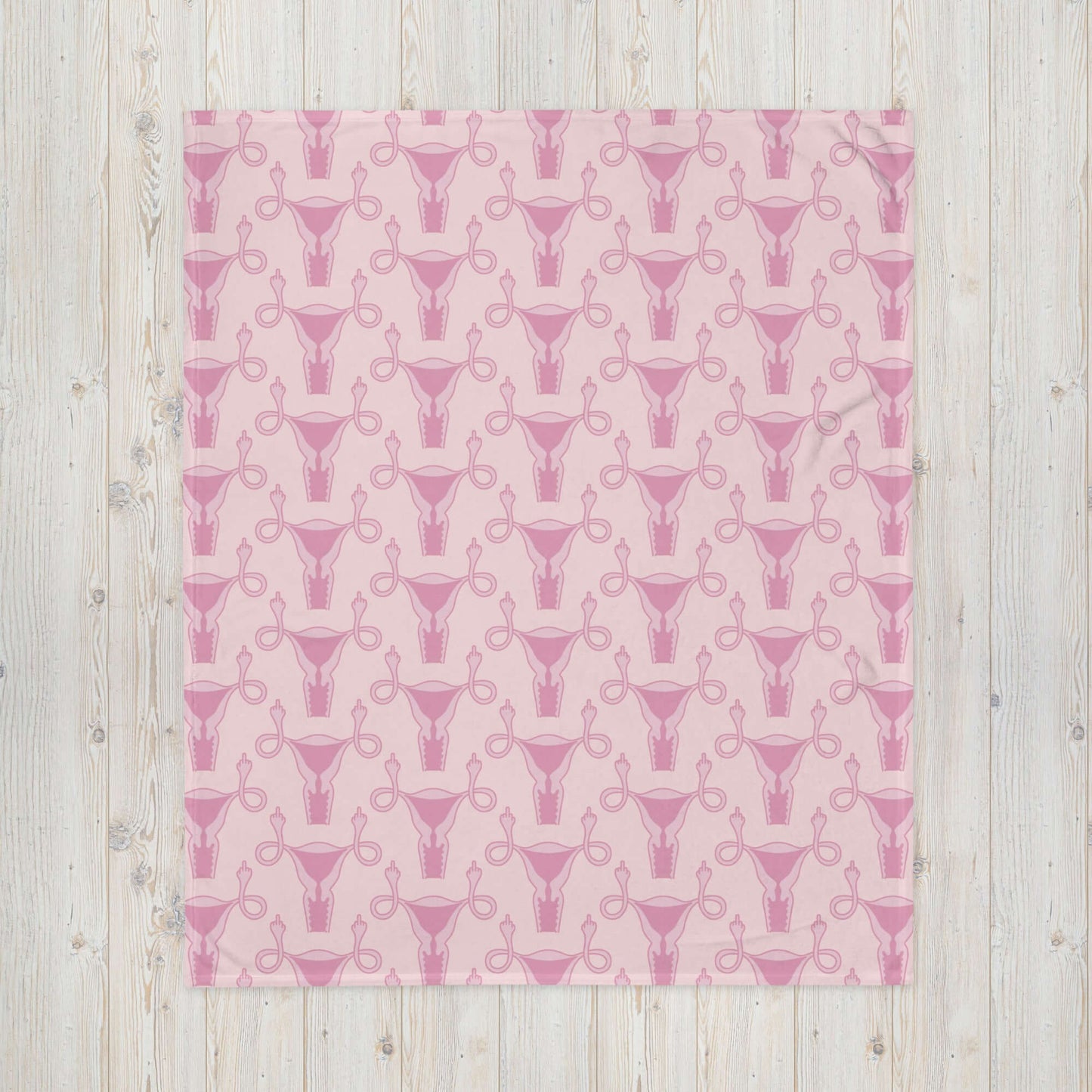 Pink fleece throw blanket with pink uterus flipping middle finger graphic printed all over.