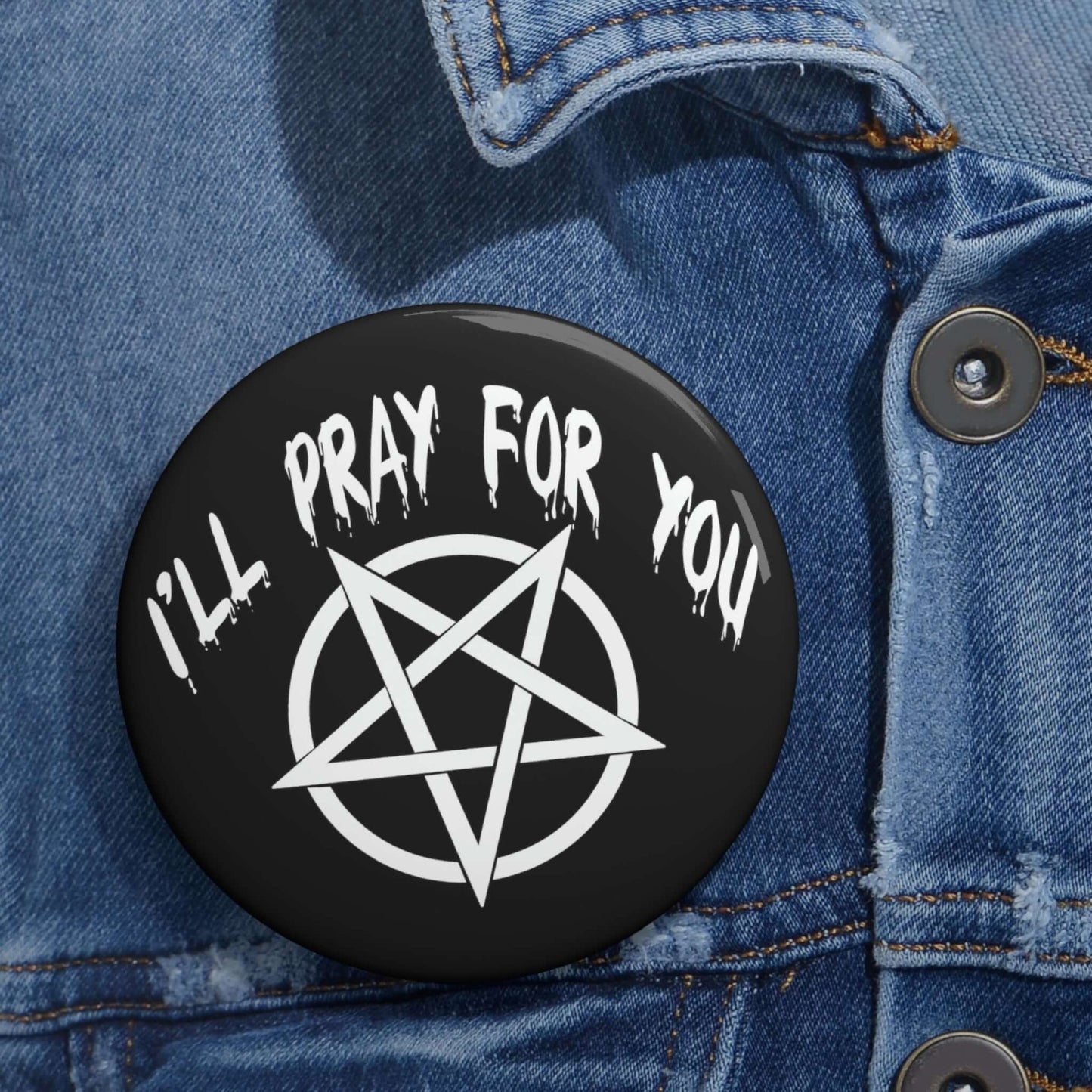 Black pinback button with image of a pentagram and the words I'll pray for you.