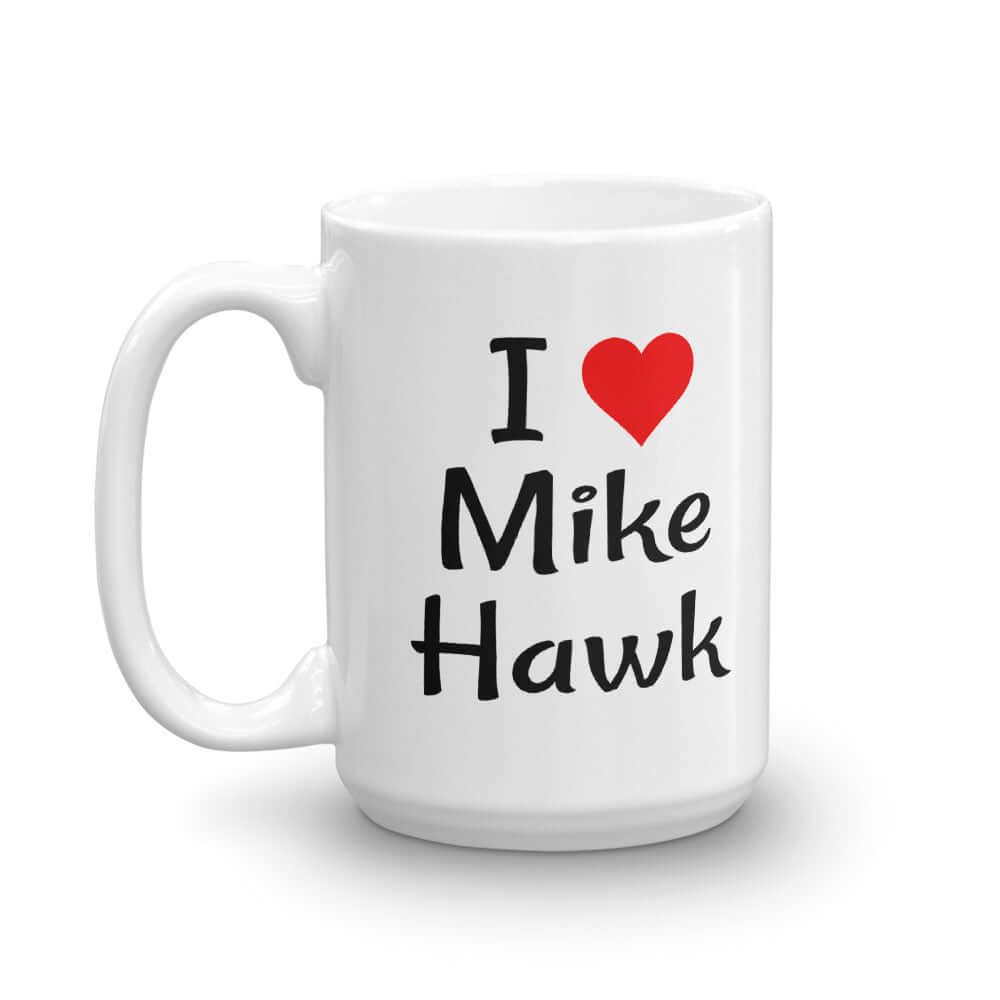 White ceramic coffee mug with the pun I heart Mike Hawk printed on both sides of the mug.