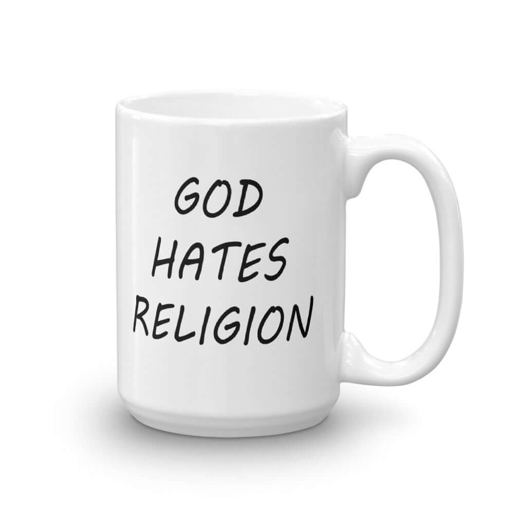 White ceramic mug with with the words God hates religion printed on both sides of the mug.