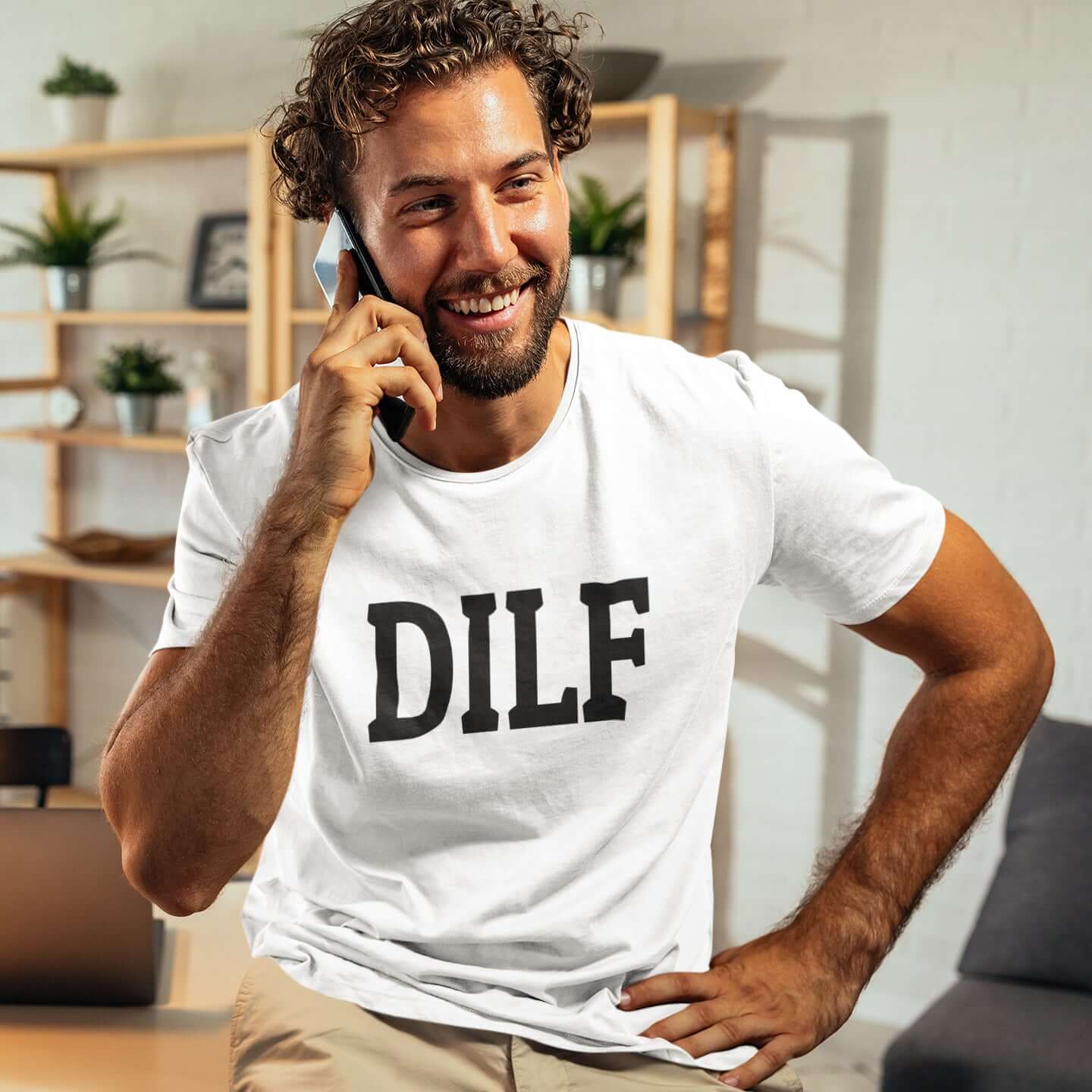 Man wearing a white t-shirt with the acronym DILF printed on the front.
