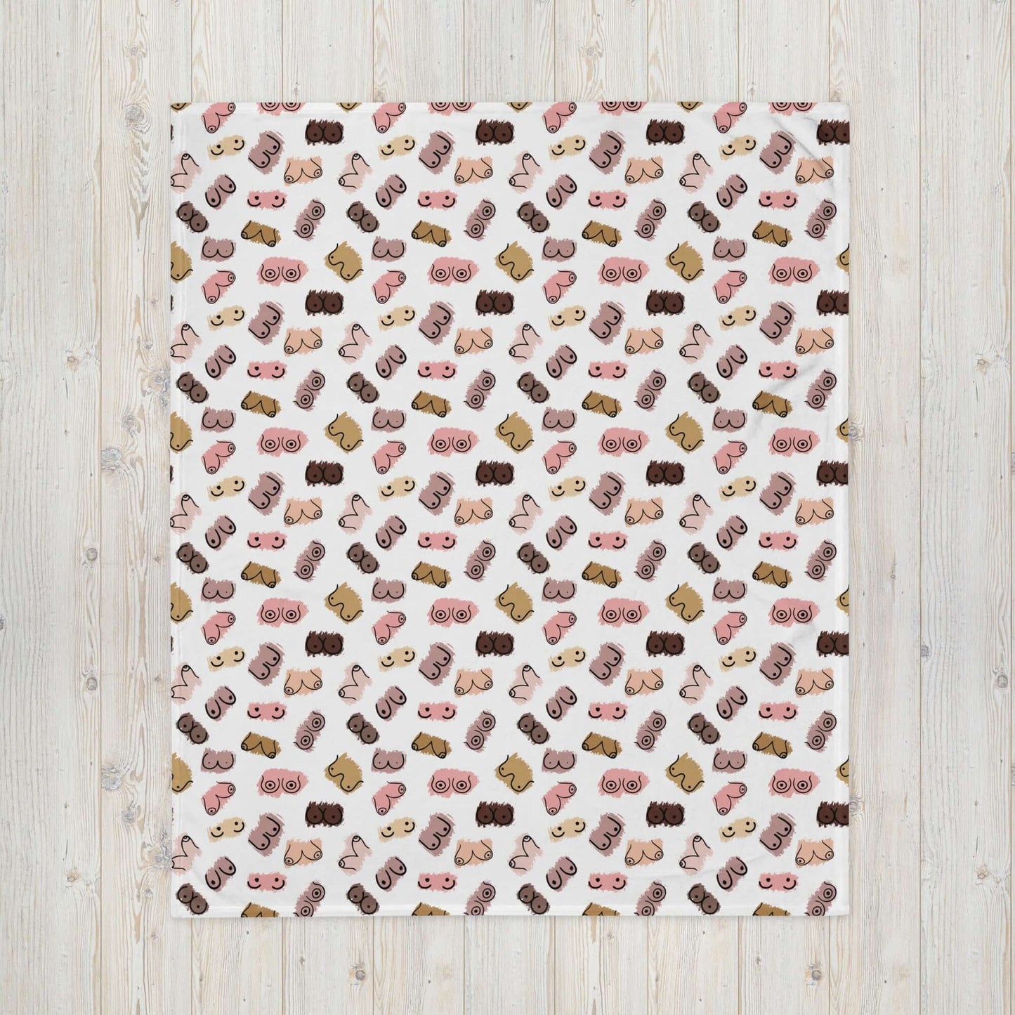 White fleece throw blanket with drawings of breasts in various skin tones printed all over.