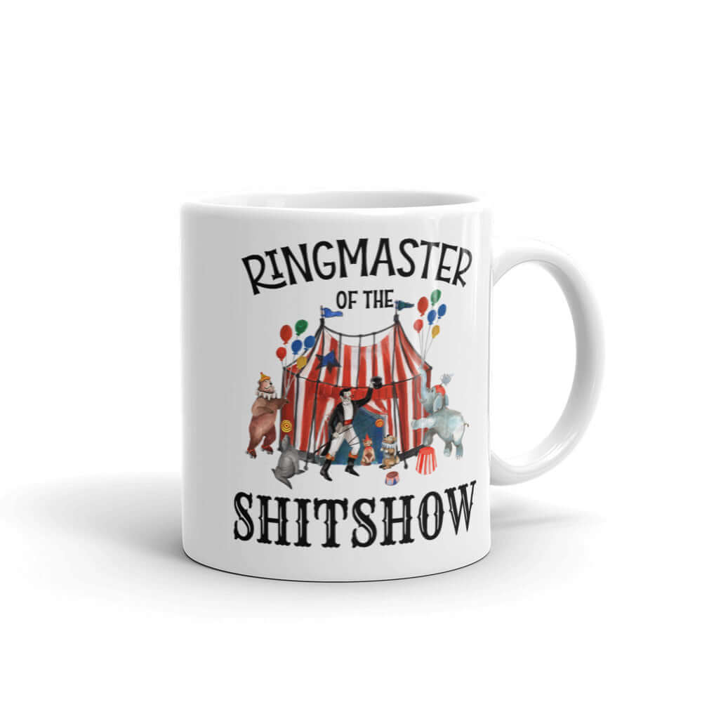 White ceramic coffee mug with a circus theme graphic and the words Ringmaster of the Shitshow printed on both sides.