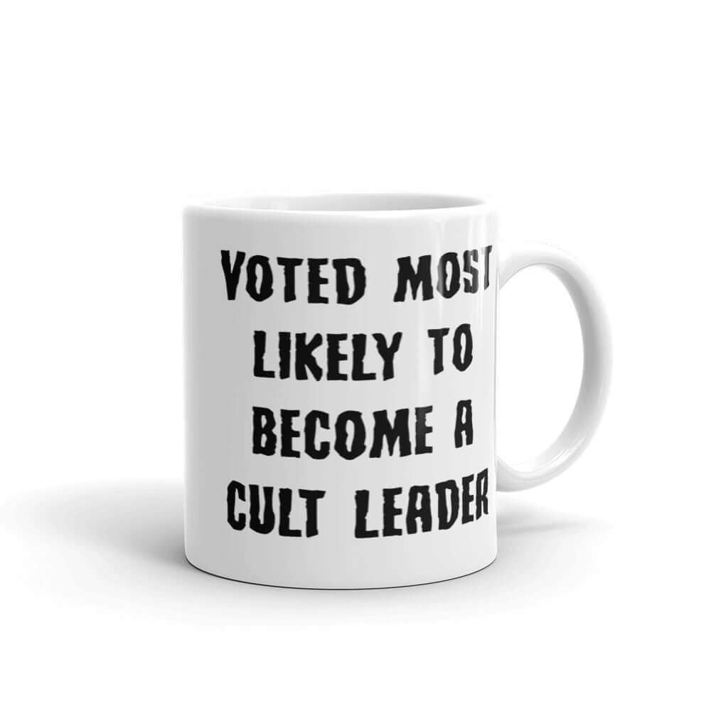 White ceramic mug with the words Voted most likely to become a cult leader printed on both sides.