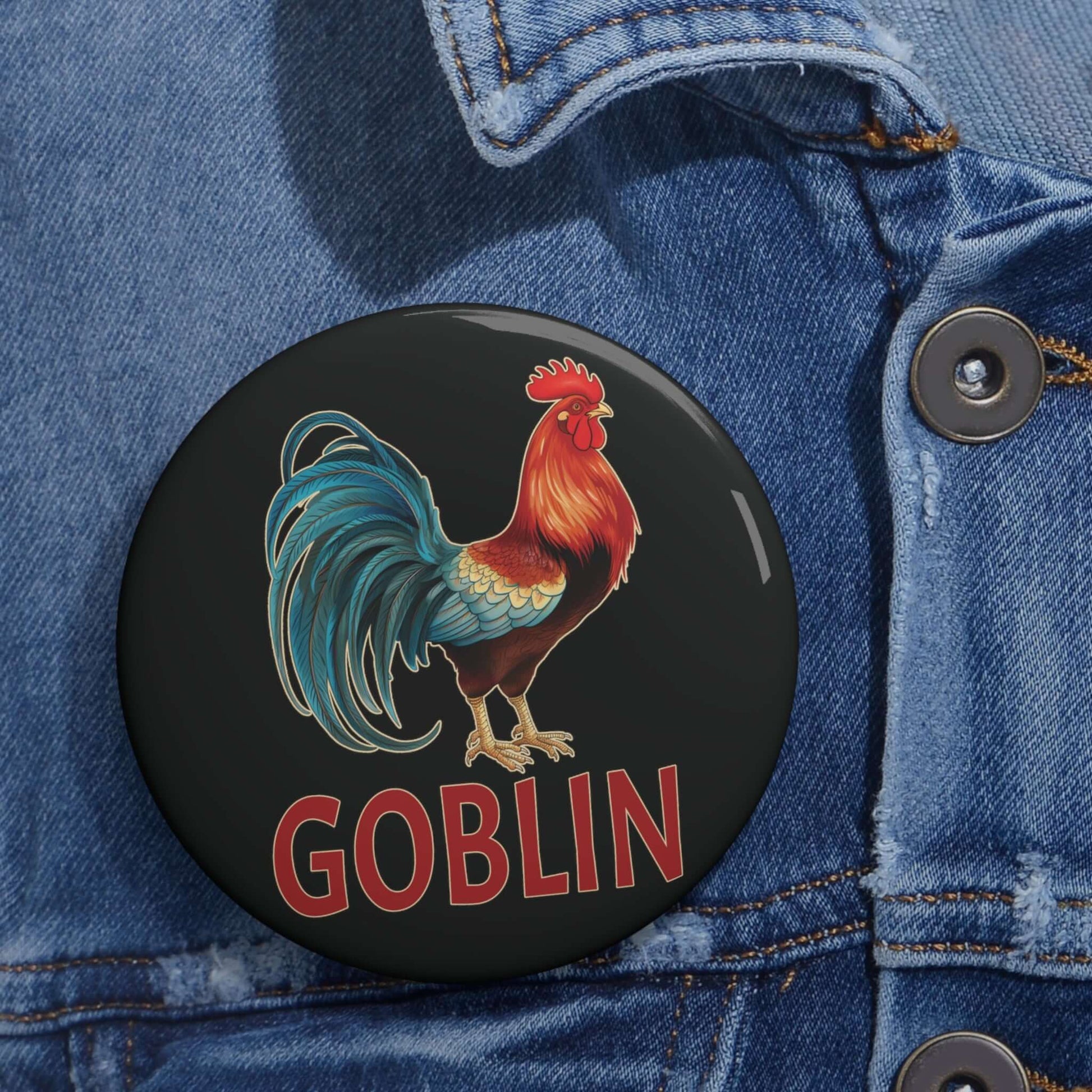 black pin-back button with image of a rooster and the word "Goblin" printed under the rooster