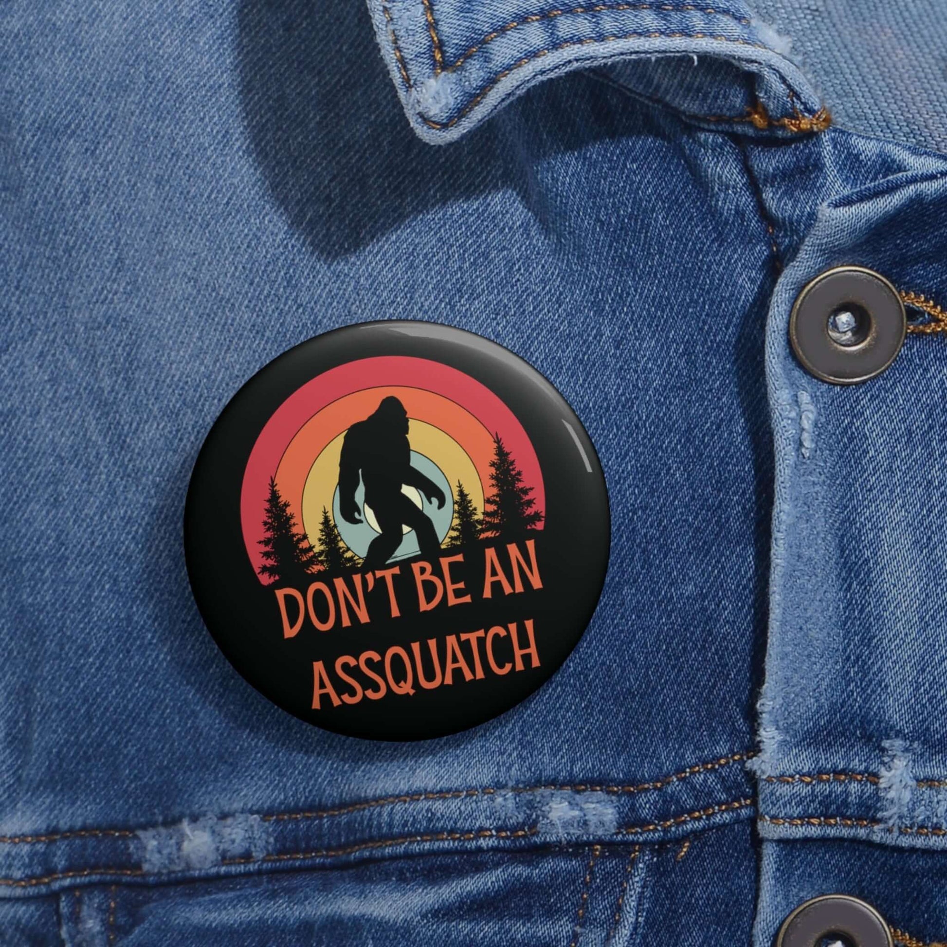 Pinback button with image of a sasquatch and text that says Don't be an assquatch.