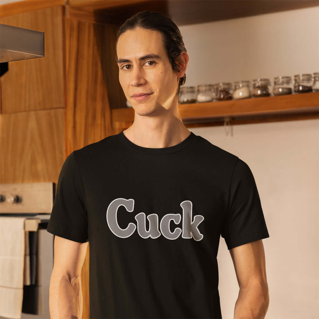 Man wearing black t-shirt with the word Cuck printed on the front in grey text.