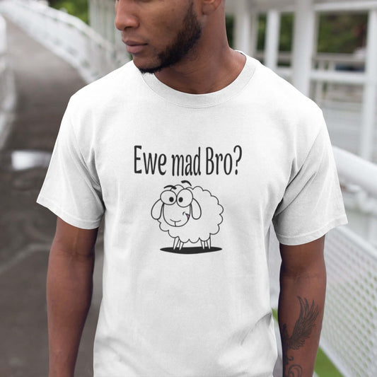 Man wearing a white t-shirt with an image of a sheep and the pun phrase Ewe mad bro question mark printed on the front. The word you is spelled e w e instead of y o u.