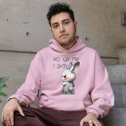 Man wearing a light pink hoodie sweatshirt. The sweatshirt has an image of an angry bunny with the phrase No talk me I angy printed on the front.