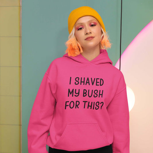 Woman wearing a heliconia pink hoodie sweatshirt with the phrase I shaved my bush for this? printed on the front.