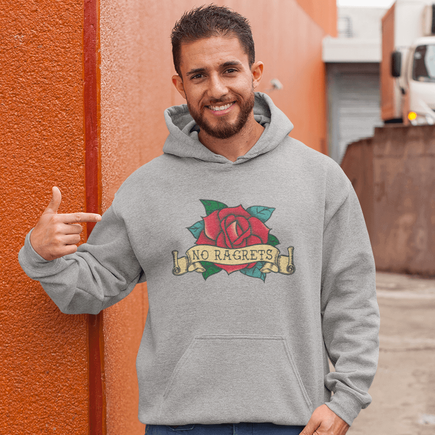 Man wearing light grey hoodie sweatshirt with funny image of an old school rose flash tattoo with the words no ragrets intentionally misspelled.