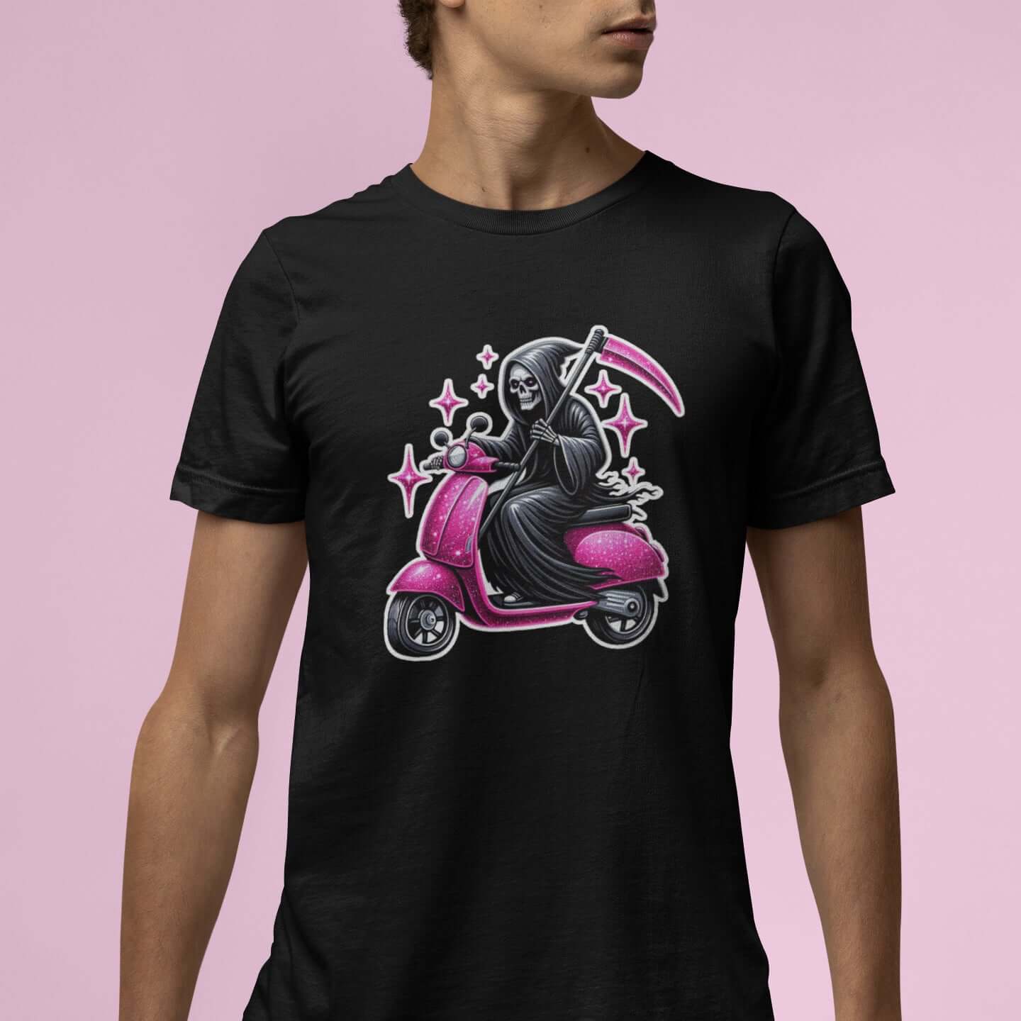 Man wearing black t-shirt with an image of the Grim Reaper riding on a glam pink scooter printed on the front.
