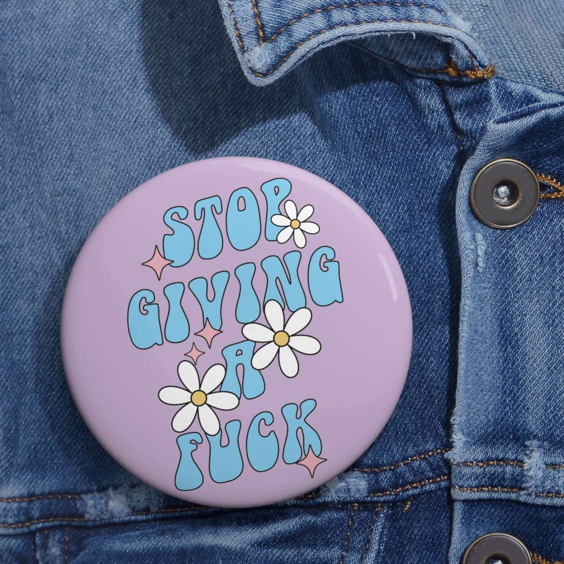 Pinback button that says stop giving a fuck with cute daisy flowers.