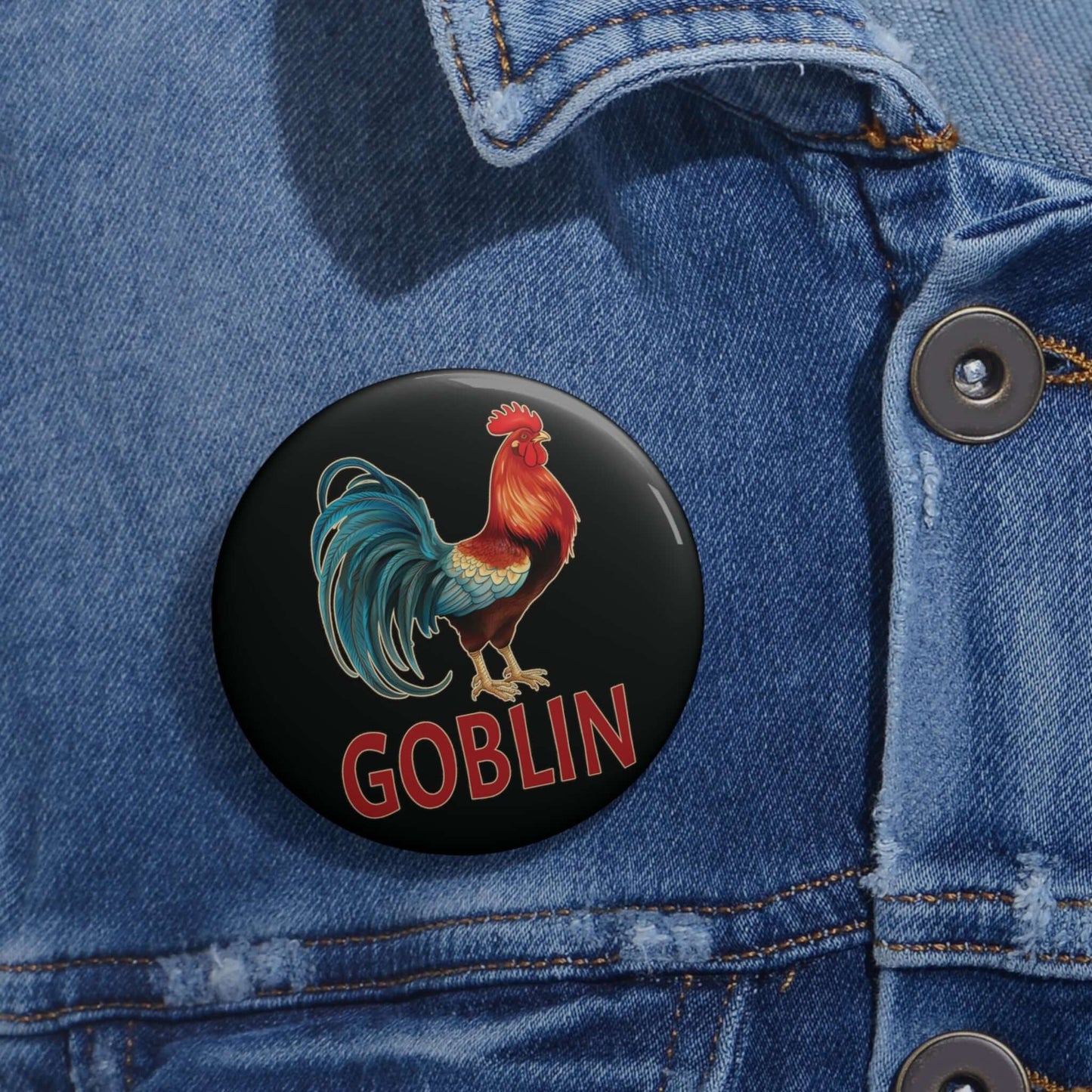 black pin-back button with image of a rooster and the word "Goblin" printed under the rooster