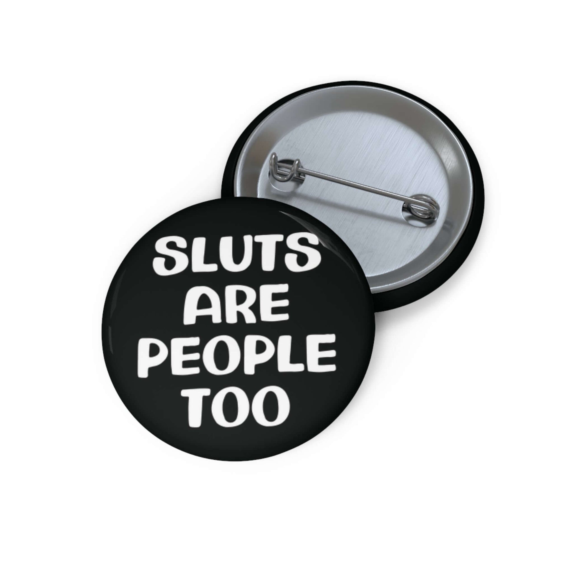 Black pinback button that says Sluts are people too.