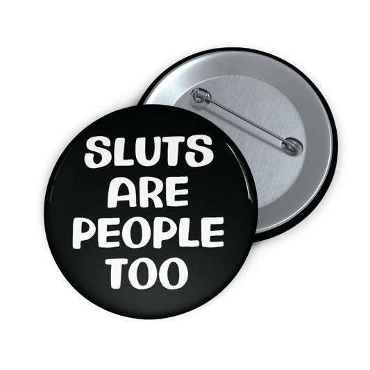 Black pinback button that says Sluts are people too.