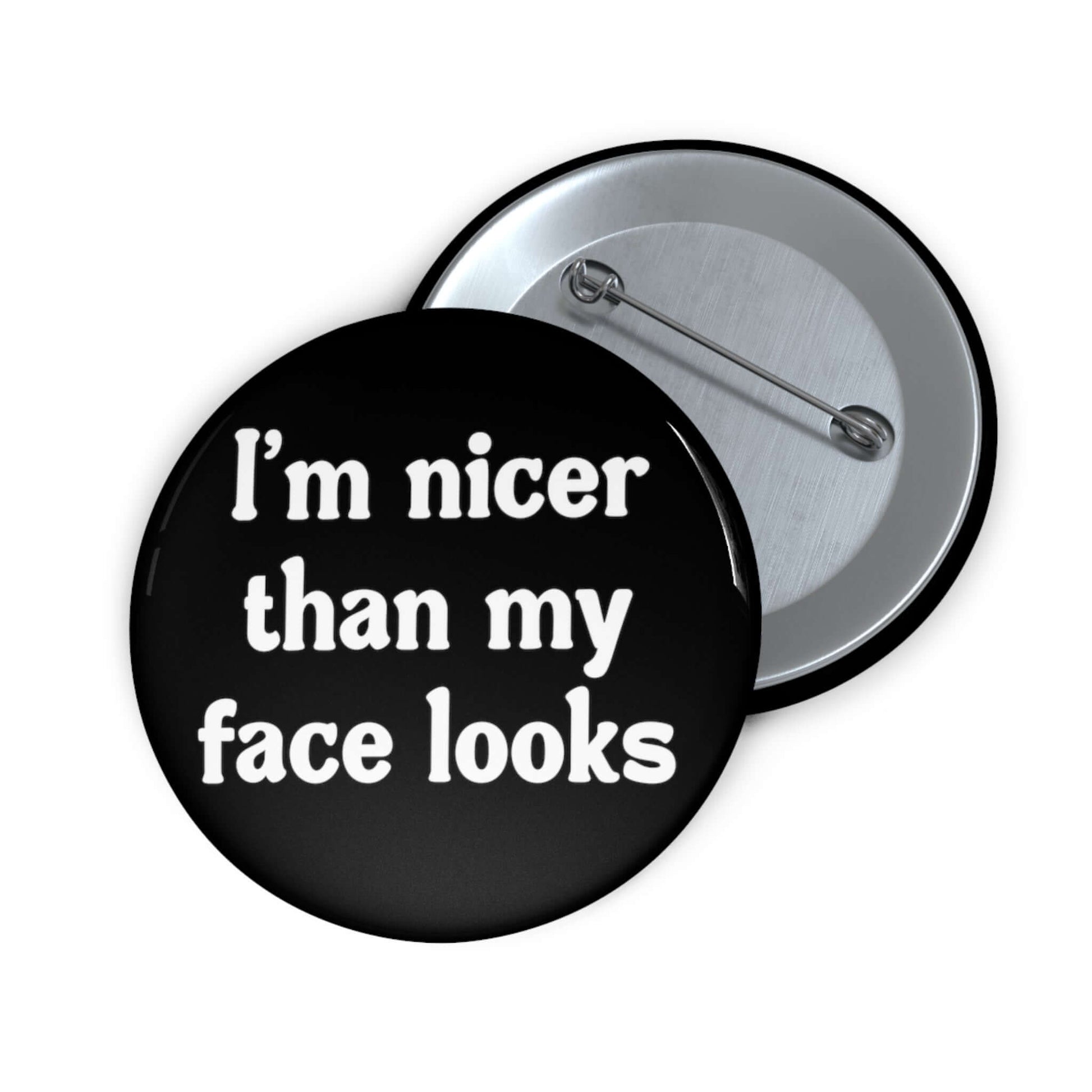 Pin-back button that says I'm nicer than my face looks.