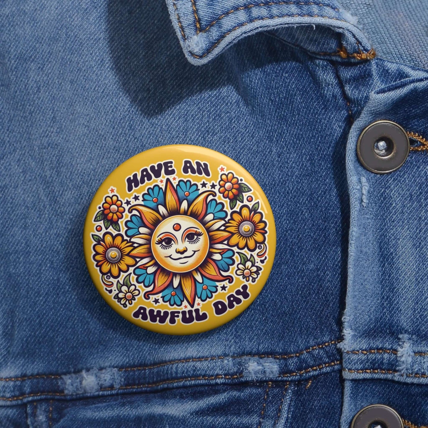 Yellow pinback button with a sun graphic and the phrase Have an awful day.