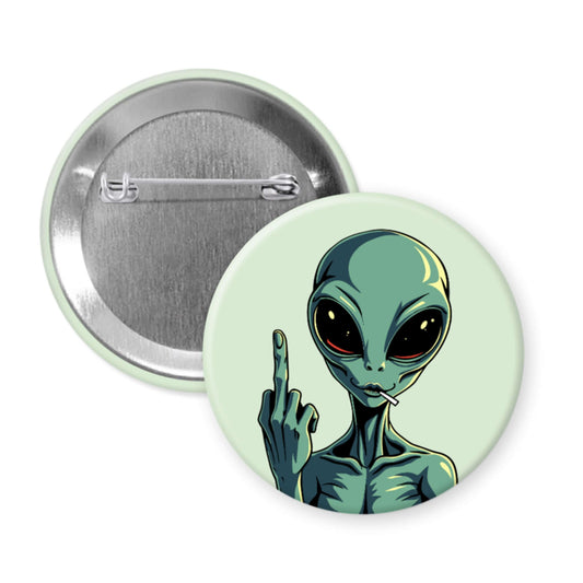 Button badge with an alien design showing a middle finger on a light green background
