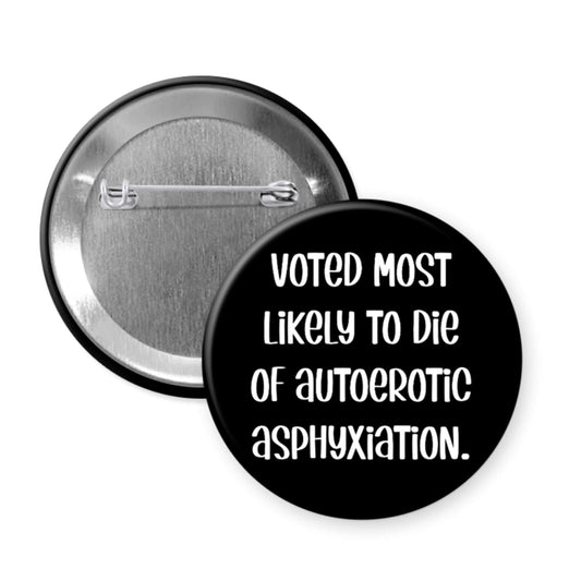 Black button badge with text 'Voted most likely to die of autoerotic asphyxiation' on a white background
