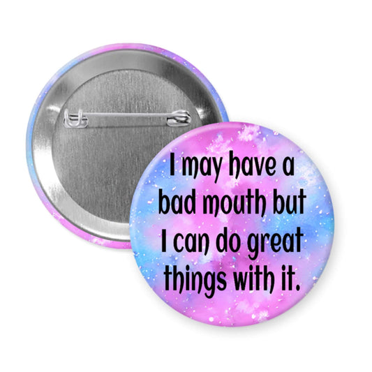 Button badge with motivational quote on a colorful background
