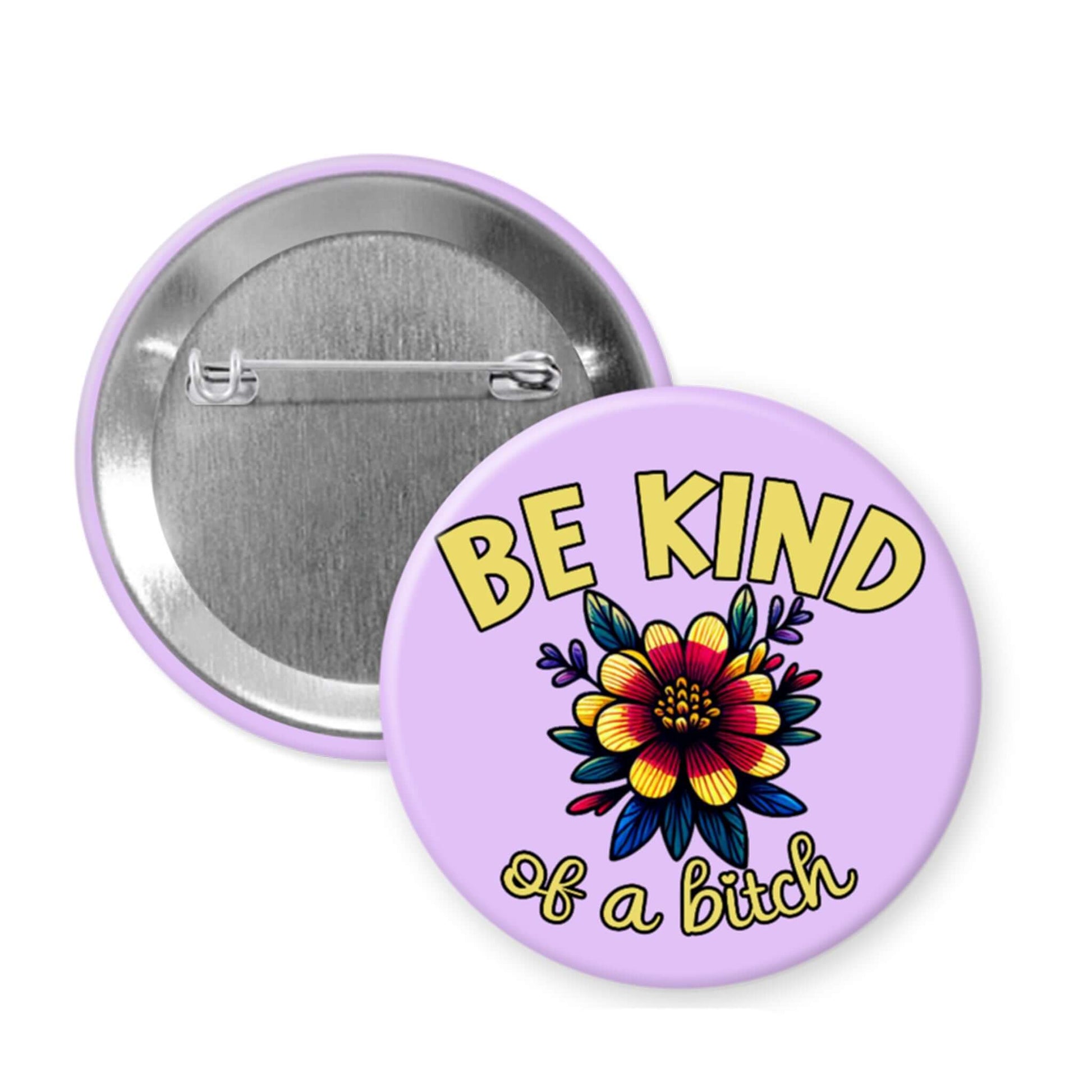 Button badge with 'Be Kind of a Bitch' text and colorful flower design on a purple background