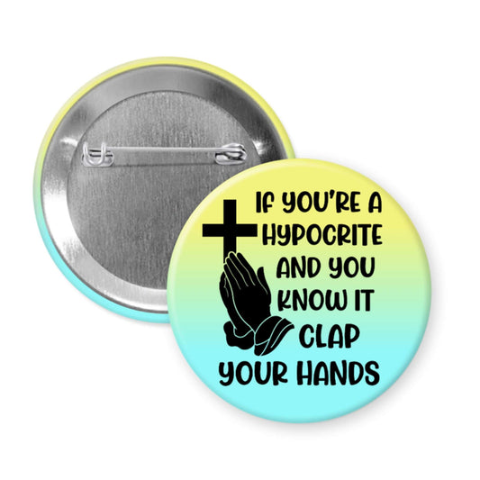 Button badge with cross and hands design and text on a gradient background