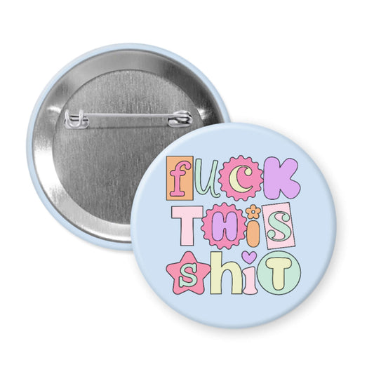 Button badge with colorful text on a light blue background