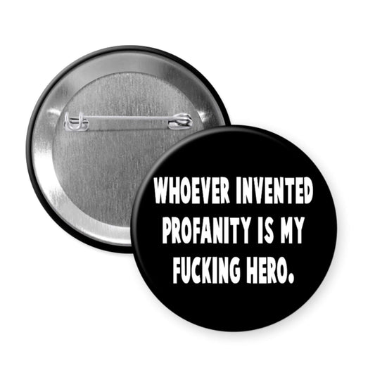 Button badge with text 'WHOEVER INVENTED PROFANITY IS MY FUCKING HERO.' on a white background