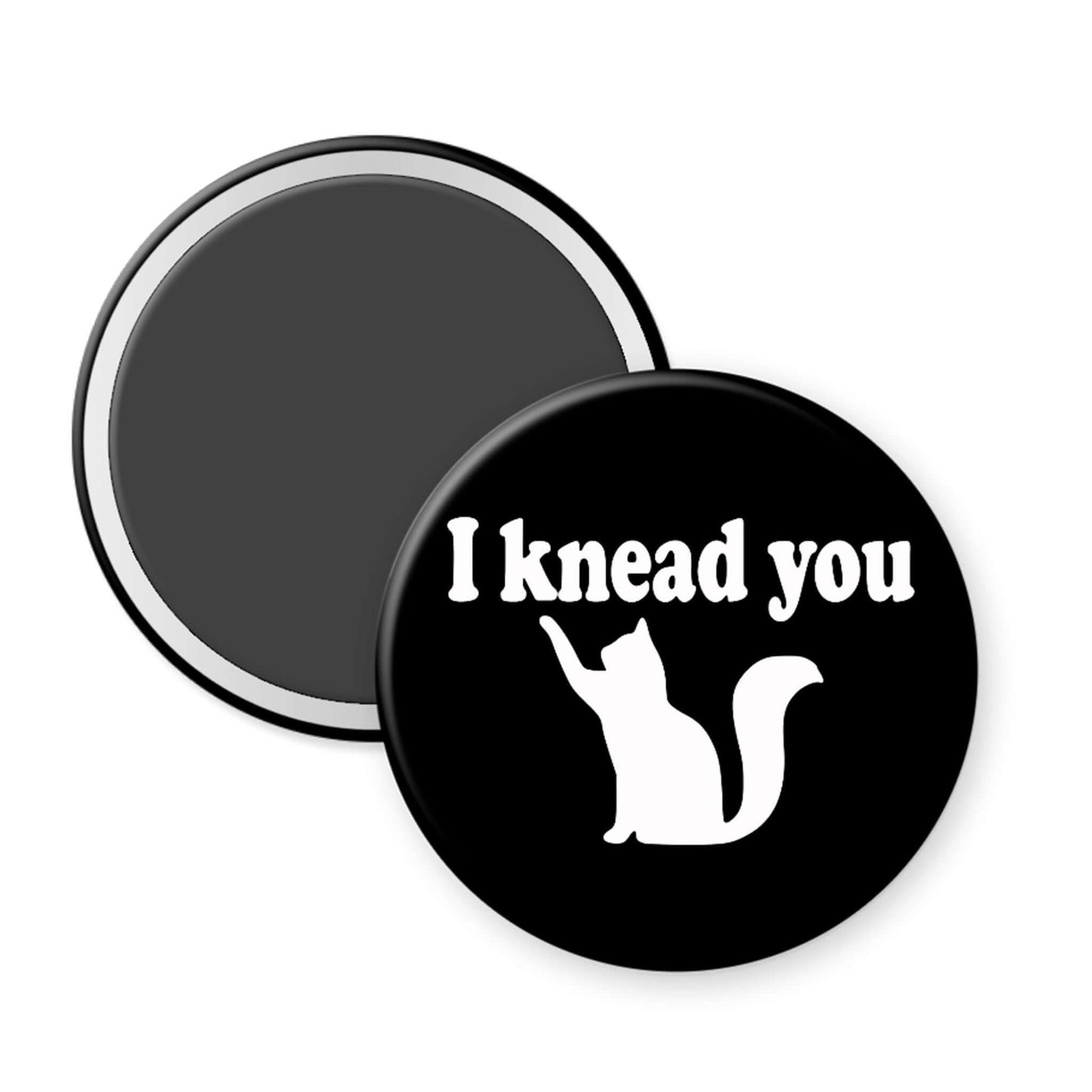 Black magnet with 'I knead you' text and cat illustration on a white background
