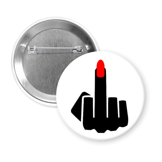 Button badge with a design of a middle finger with red nail polish on a white background