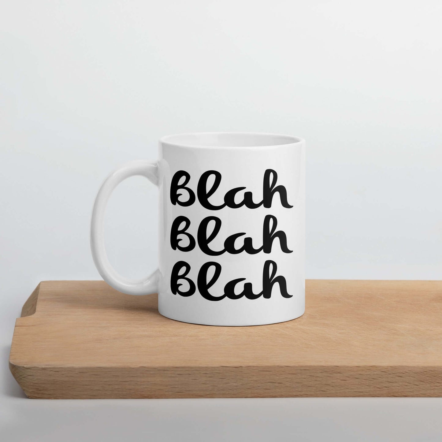 White ceramic coffee mug with the words Blah Blah Blah printed on both sides.