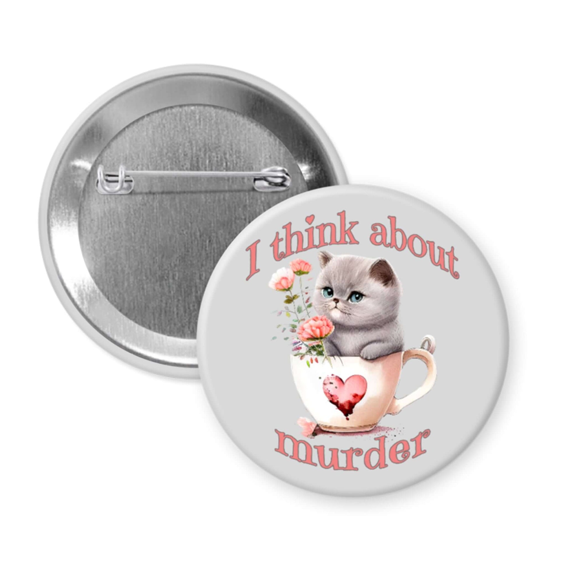 Button badge with a cat in a teacup design and text 'I think about murder' on a light grey background.
