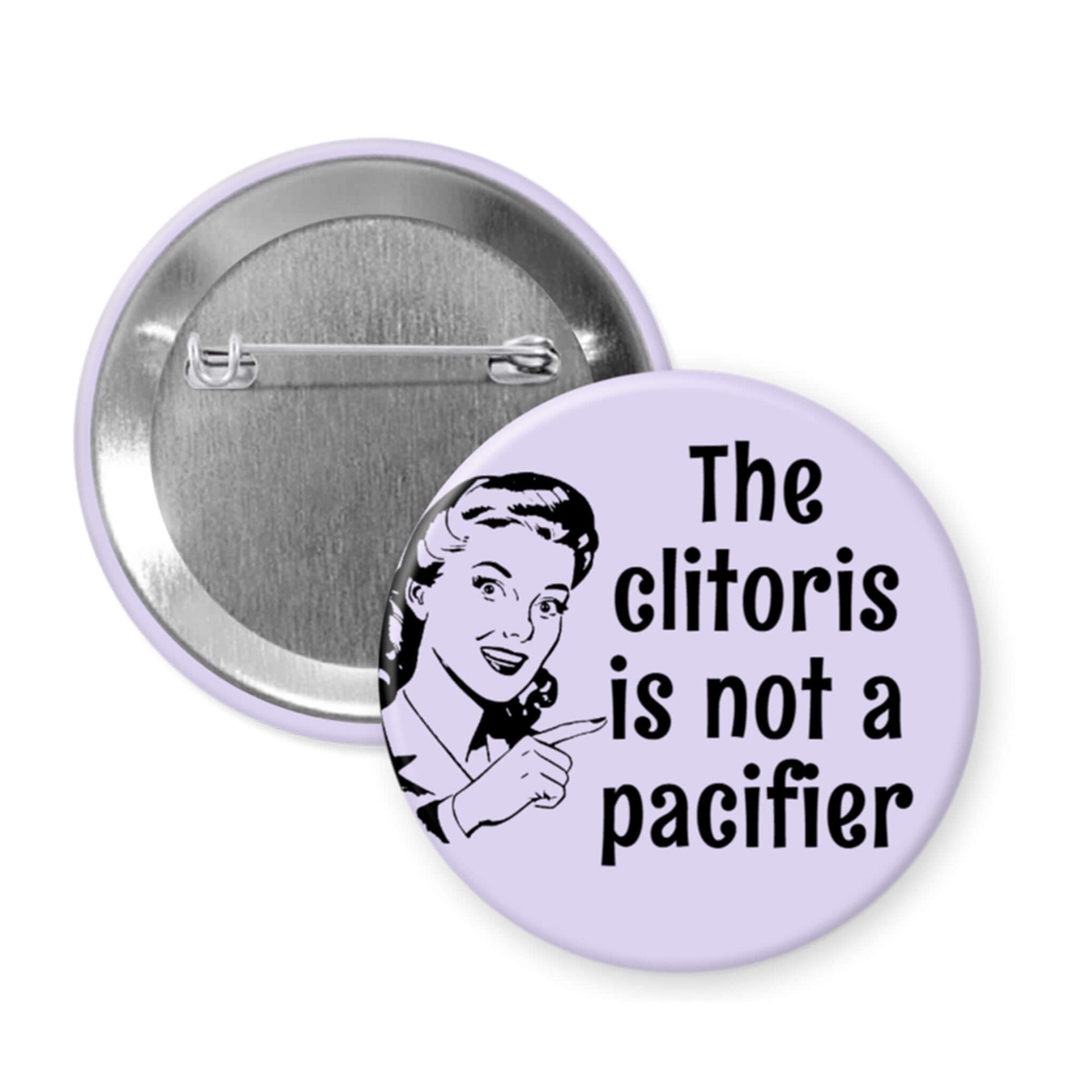 Button badge with a graphic and text 'The clitoris is not a pacifier' on a white background