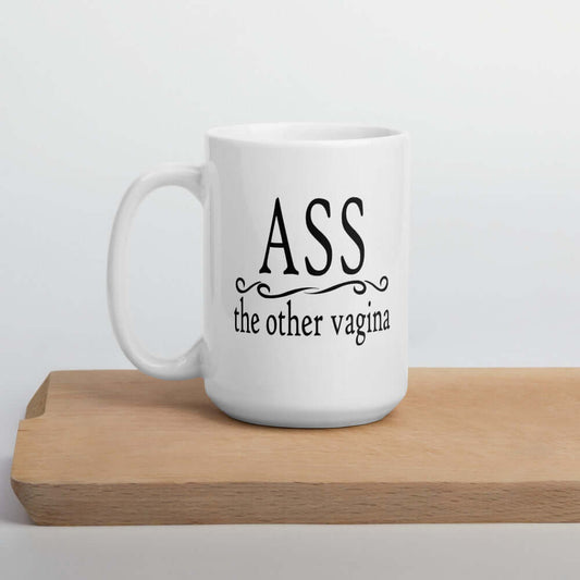 15 ounce white ceramic coffee mug with the words Ass, the other vagina printed on both sides.