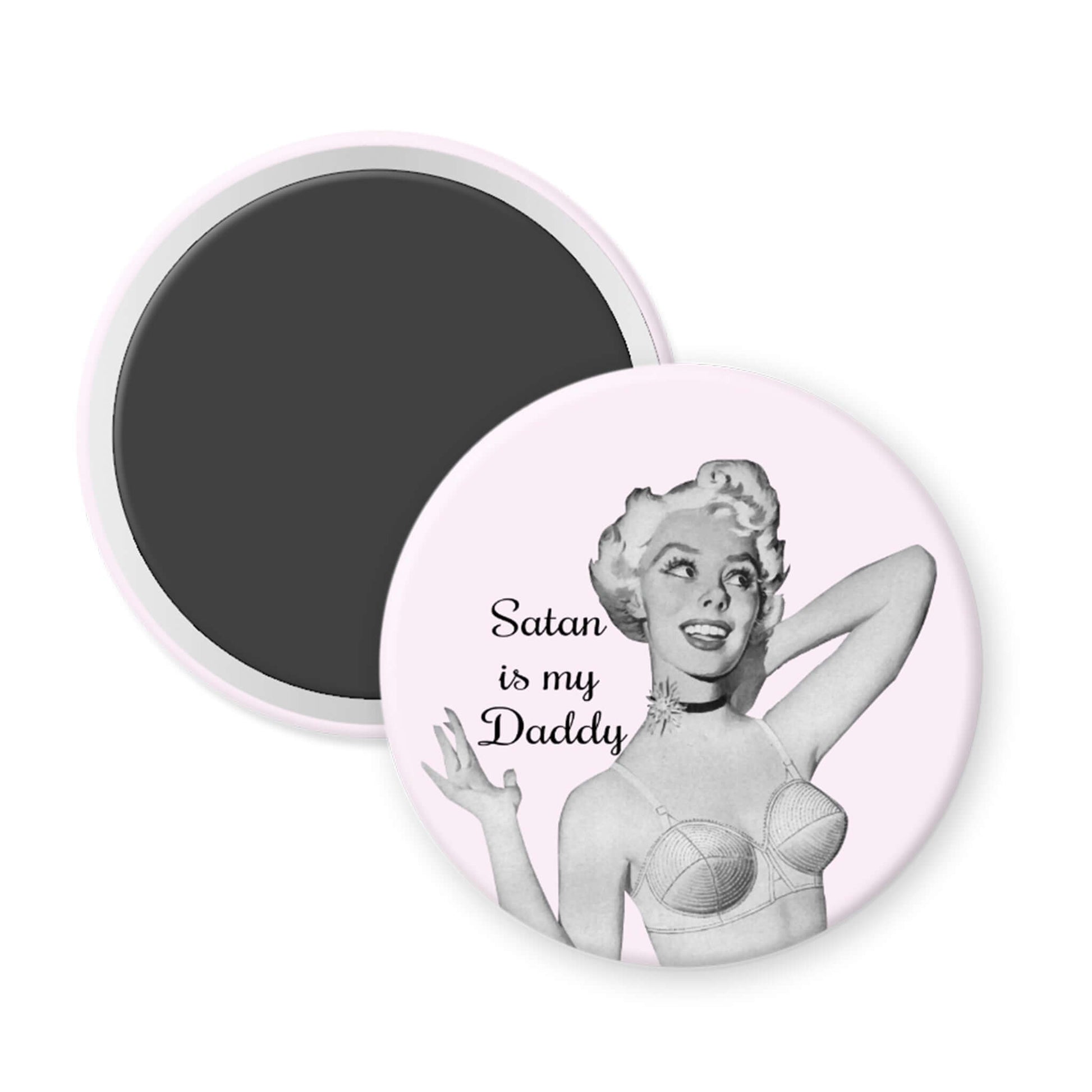 Circular magnet with a black and white illustration of a woman and text 'Satan is my Daddy' on a pink background.