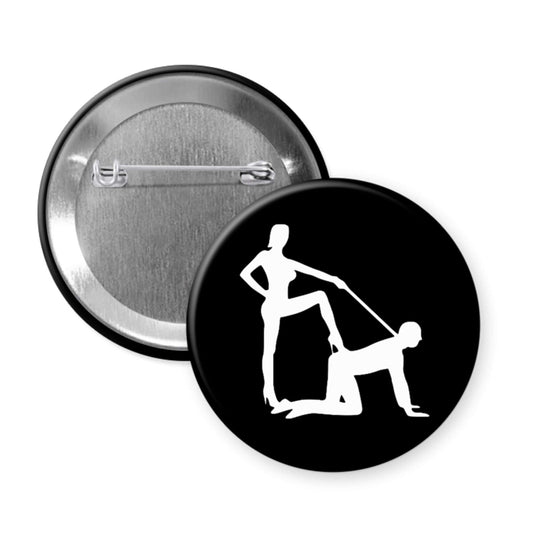 Pinback button with silhouette image of a man on his hands and knees and a dominatrix holding his leash.