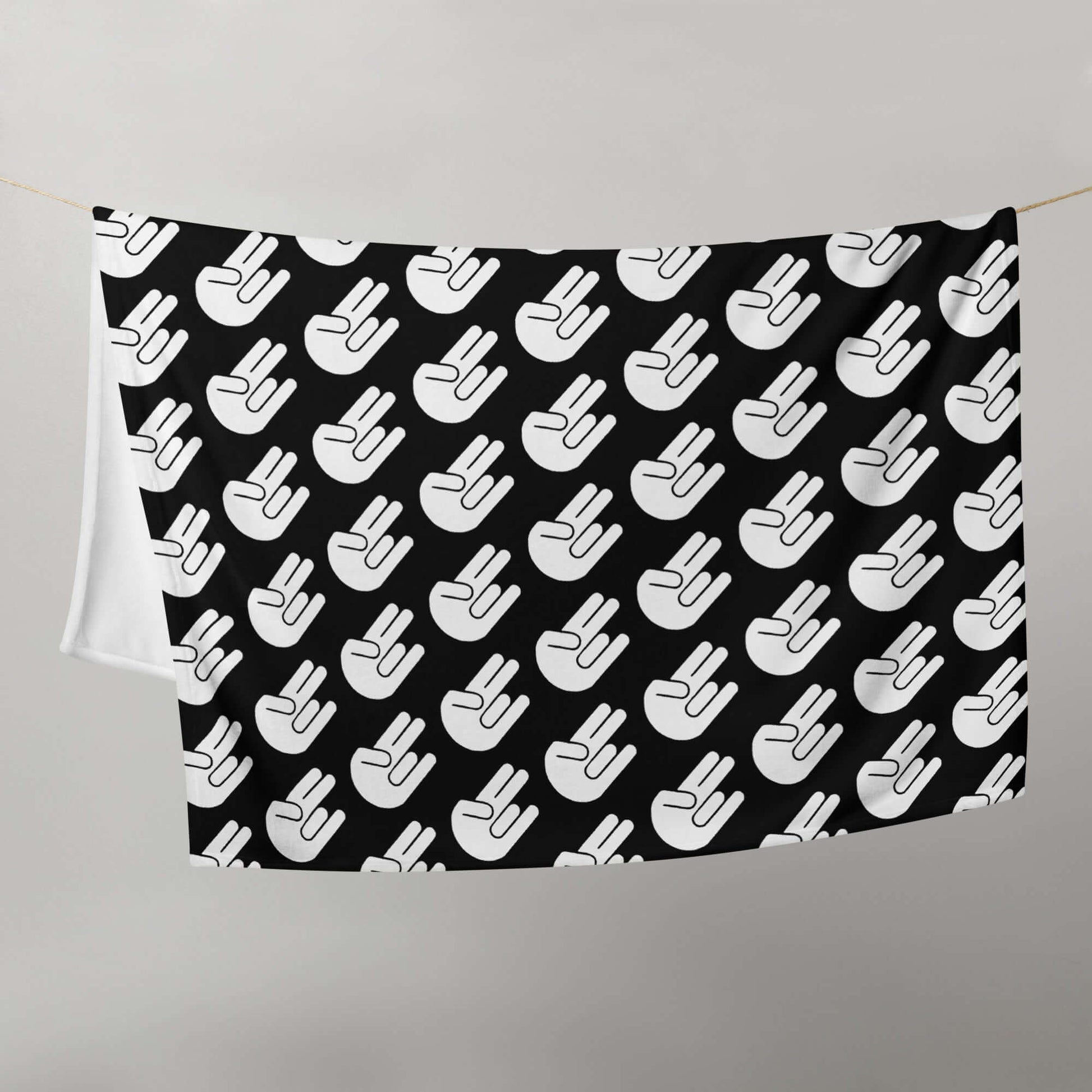 Black fleece throw blanket with image of The Shocker printed all over.