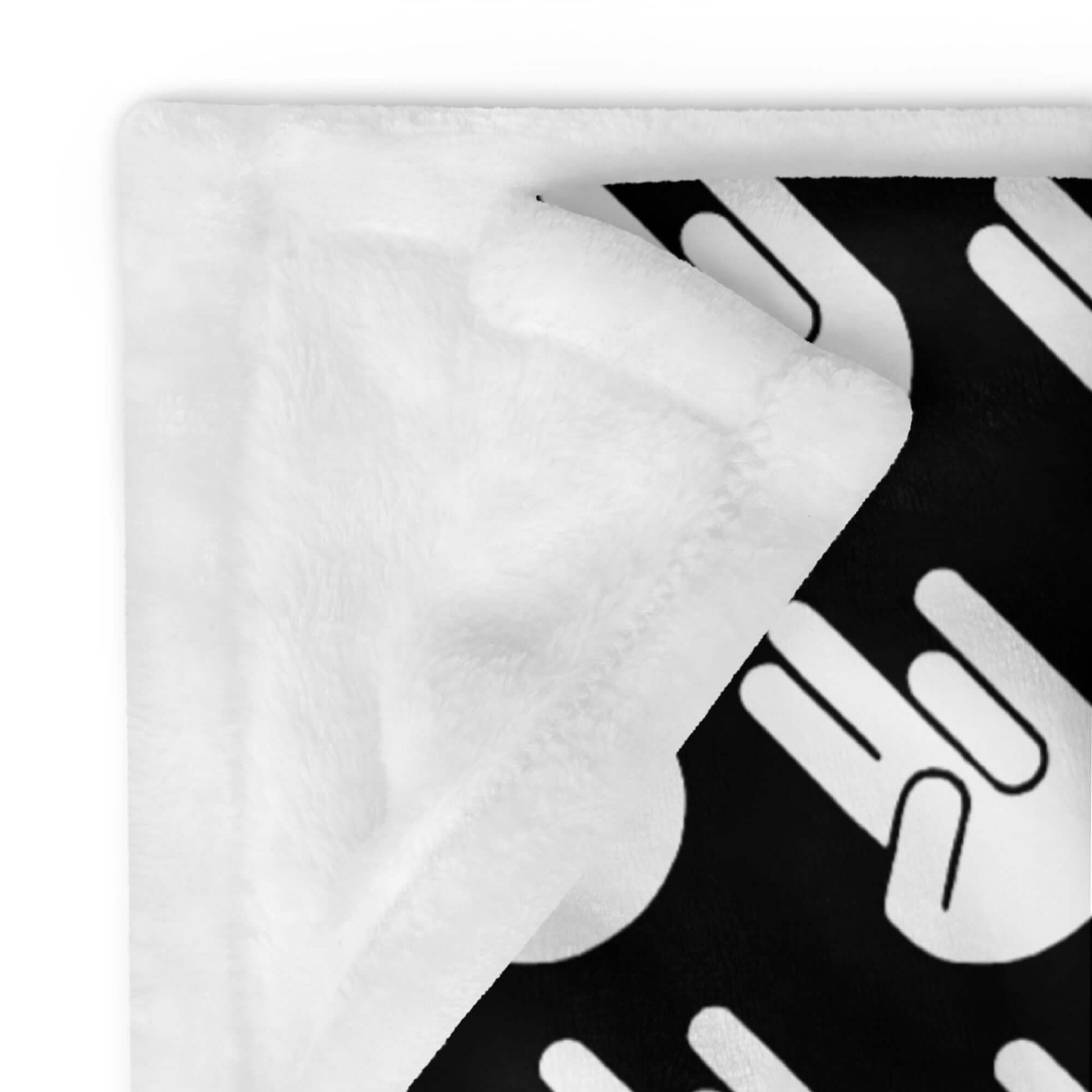 Black fleece throw blanket with image of The Shocker printed all over.