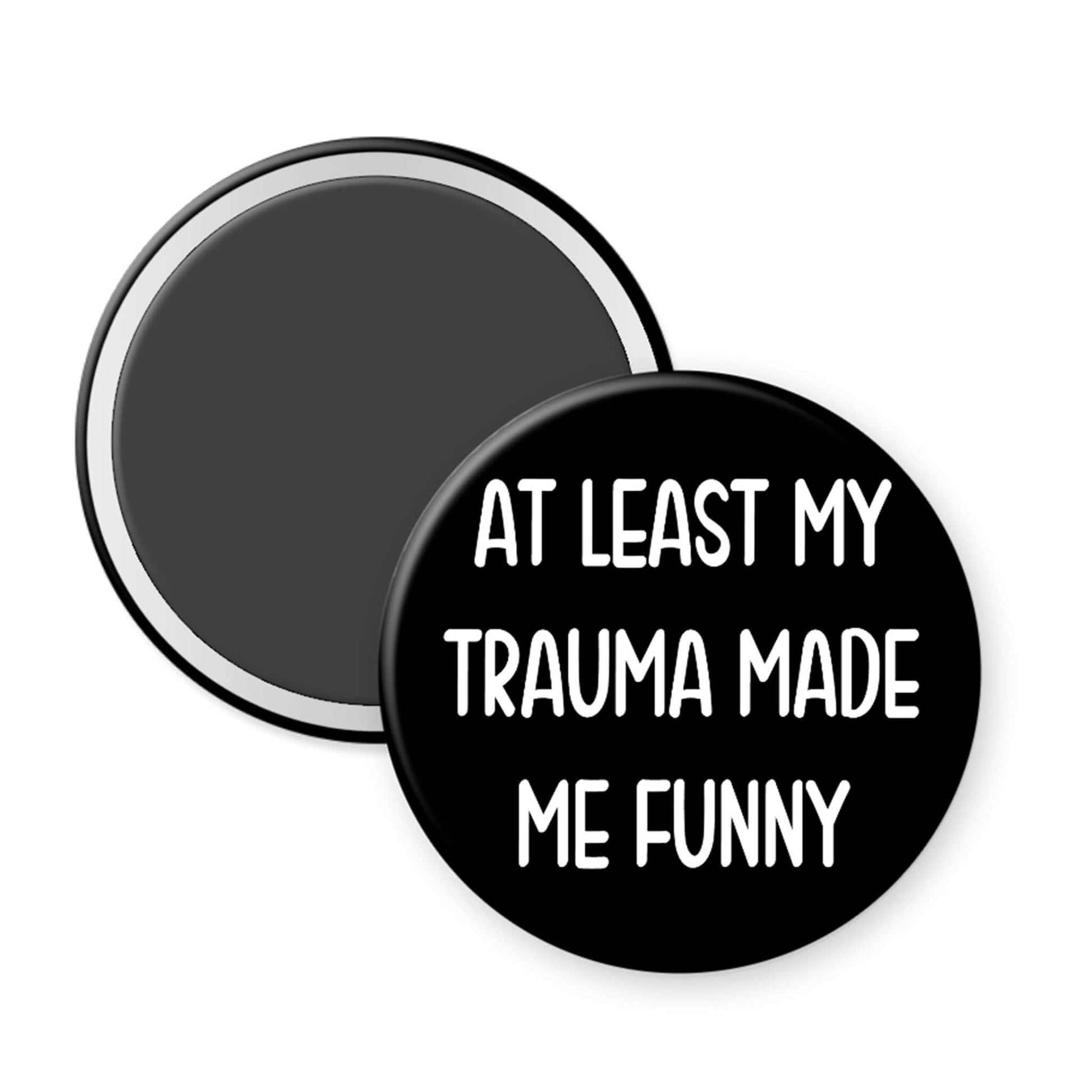 Black button with white text 'AT LEAST MY TRAUMA MADE ME FUNNY' on a white background