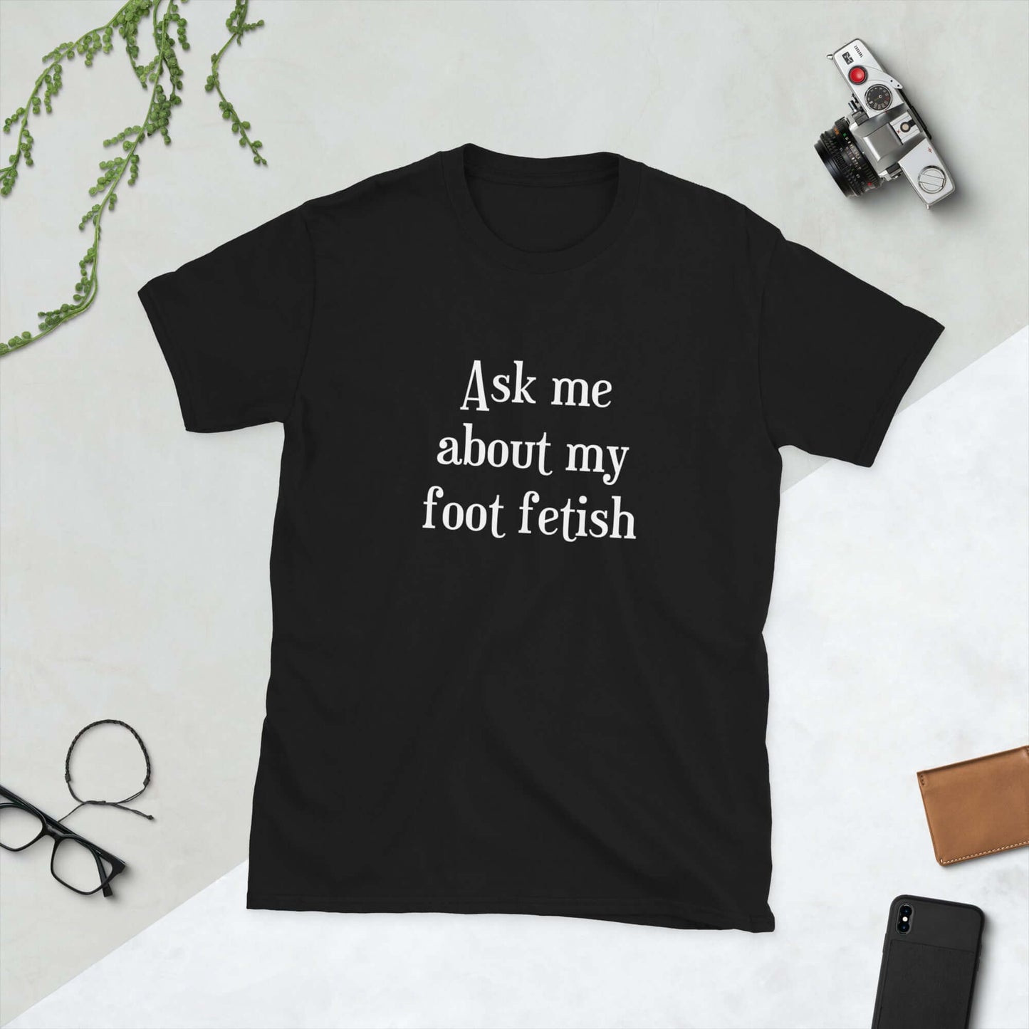 Black t-shirt with the words Ask me about my foot fetish printed on the front.