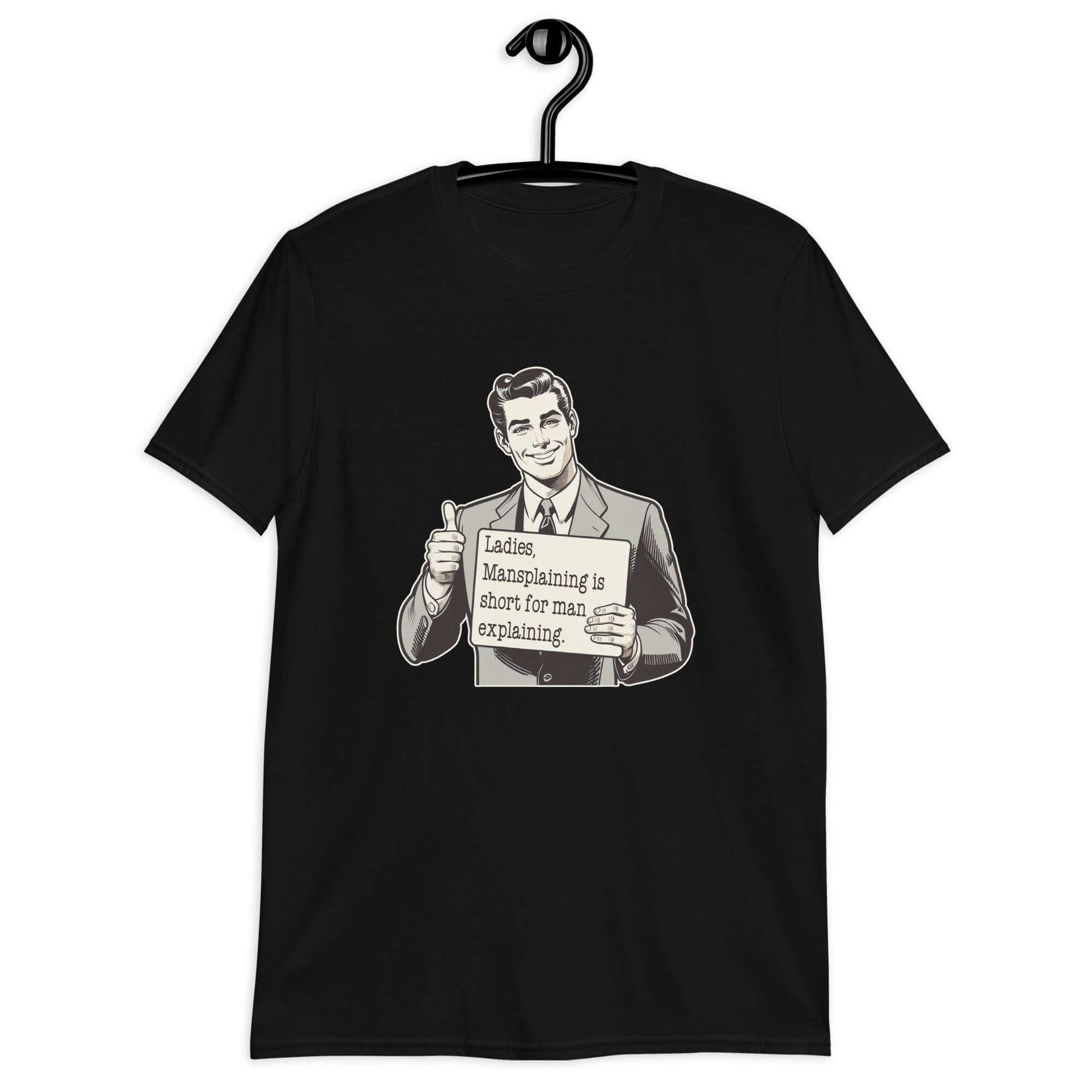 Black t-shirt with a graphic of a retro man holding a sign. The sign says Ladies, mansplaining is short for man explaining. The graphics are printed on the front of the shirt.