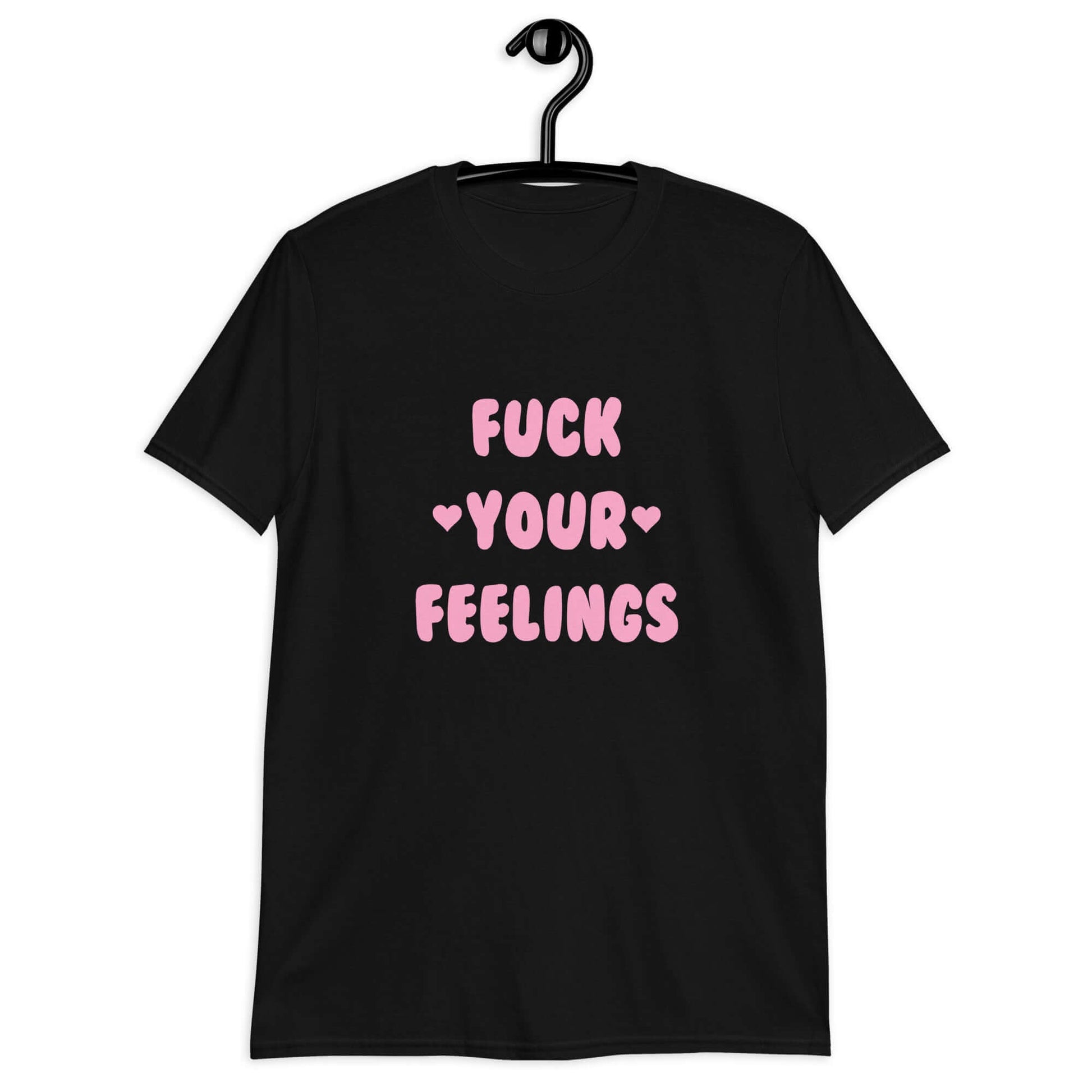 Black t-shirt with the words Fuck your feelings printed on the front in pink. There are cute pink hearts next to the words.