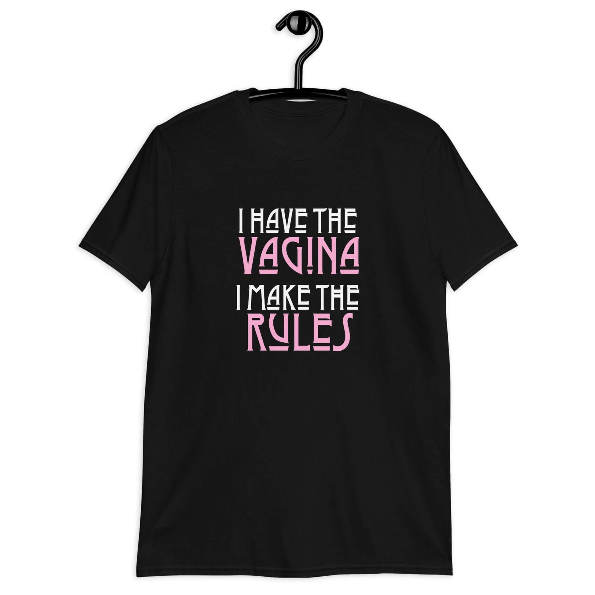 Black t-shirt with the words I have the vagina , I make the rules printed on the front. The words vagina and rules are pink, the rest of the words are white.