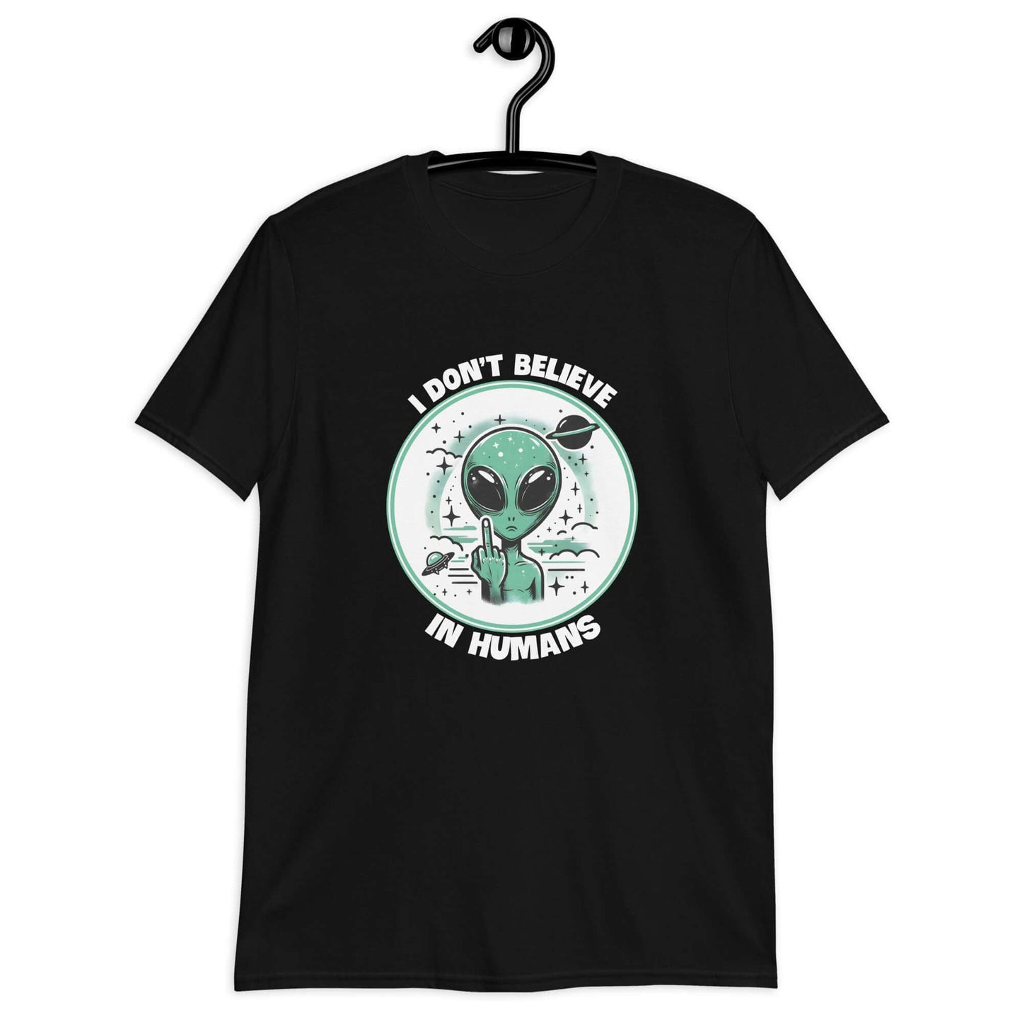 Black t-shirt with an image of an alien flipping the middle finger. The words I don't believe in humans are printed around the image. The graphics are printed on the front of the shirt.