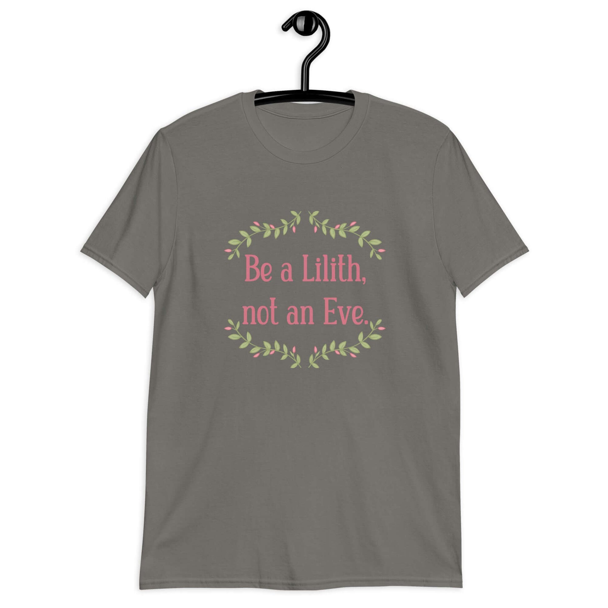 Charcoal grey t-shirt with the phrase Be a Lilith, not an Eve printed on the front. The text is pink and had a green floral vine graphic framing the text. 