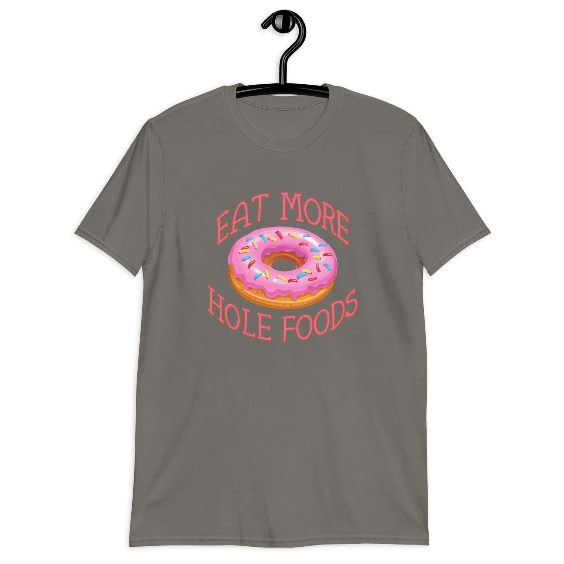 Charcoal grey t-shirt that has an image of a donut with pink icing and sprinkles and Eat more hole foods printed on the front.